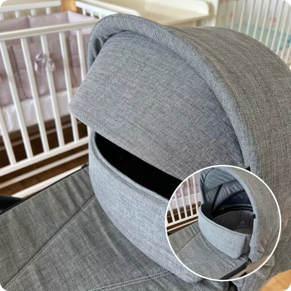 Накидка на люльку имеет отворот со смотровым окном и крепится магнитными кнопками, полностью закрывая ребёнка от непогоды.